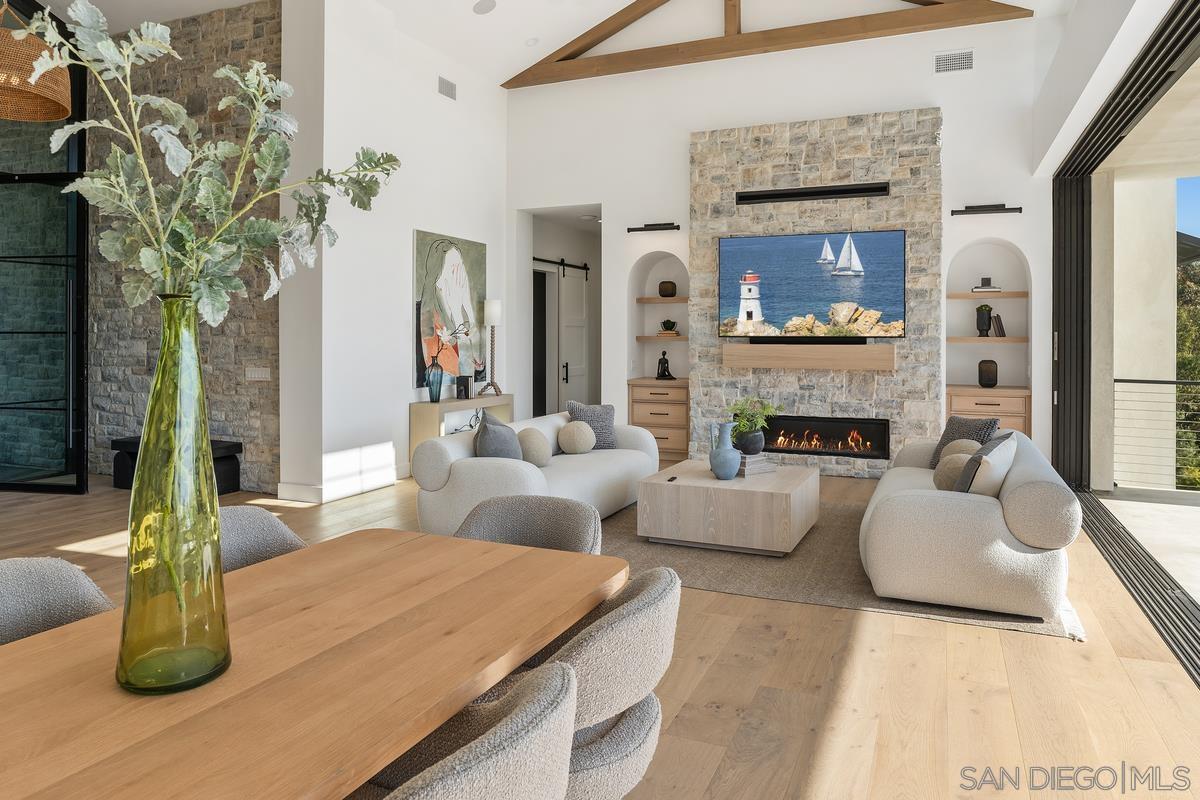 6691 Camino Saucito Rancho Santa Fe, CA 92067 - Photo 6 of 54 a living room with furniture and a fireplace