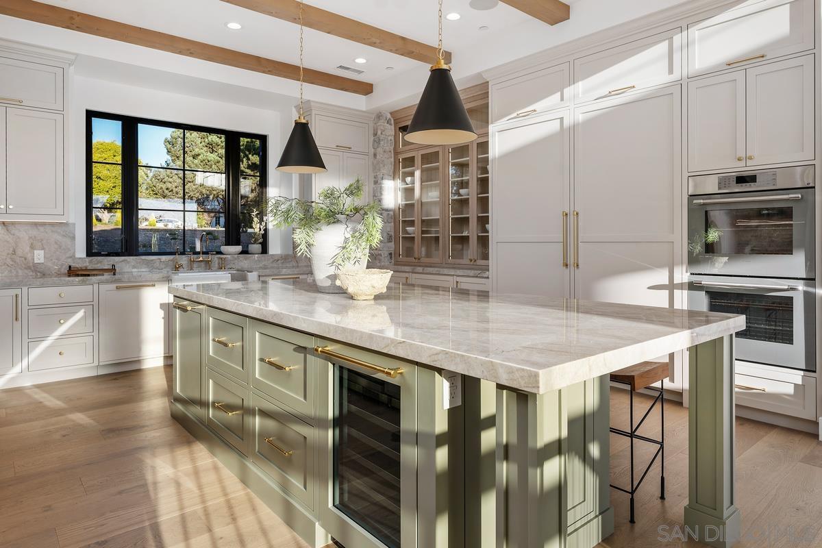 6691 Camino Saucito Rancho Santa Fe, CA 92067 - Photo 10 of 54 a kitchen with stainless steel appliances granite countertop a stove a sink and a refrigerator