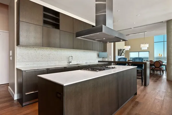 a kitchen with a stove and a refrigerator