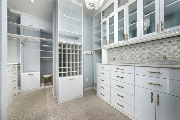 a view of an empty room with a cabinet
