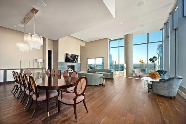 a view of a dining room with furniture and wooden floor