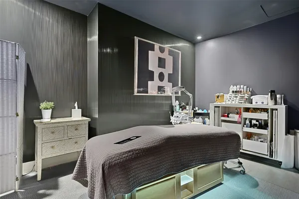 a bedroom with a bed and dresser