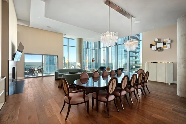 a view of a dining room with furniture window and wooden floor