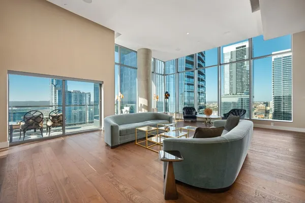 a living room with furniture and a large window