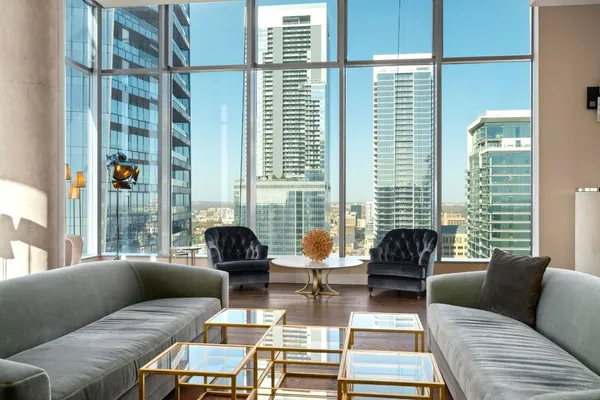 a living room with furniture and a large window