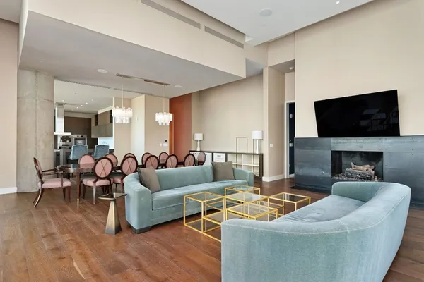 a living room with fireplace furniture and a flat screen tv
