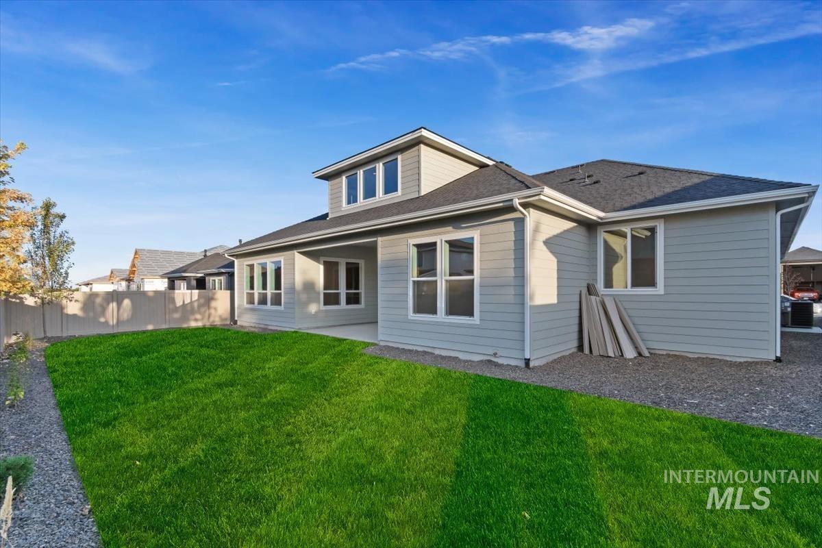 2147 East Blakehurst Avenue Kuna, ID 83634 - Photo 42 of 43 Back of house featuring a patio and a shingled roof
