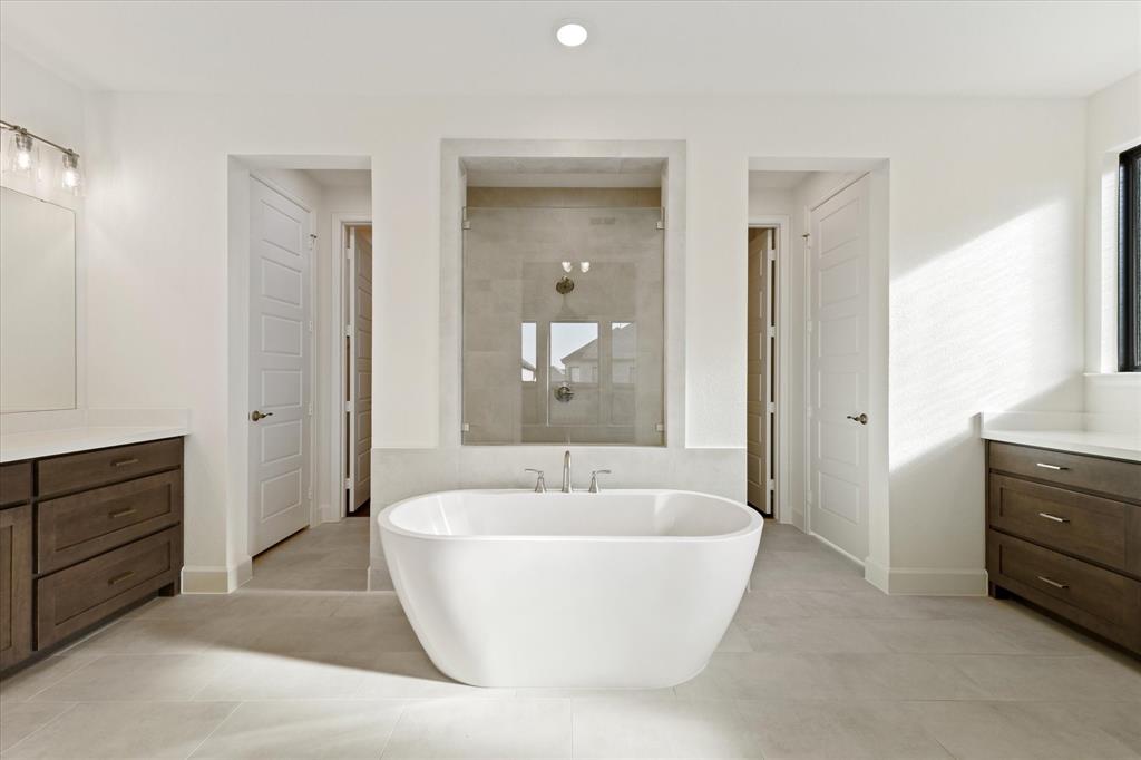 4626 Rillstone Road Midlothian, TX 76065 - Photo 15 of 40 Full bath with vanity, a freestanding tub, a walk in shower, light tile patterned floors, and recessed lighting