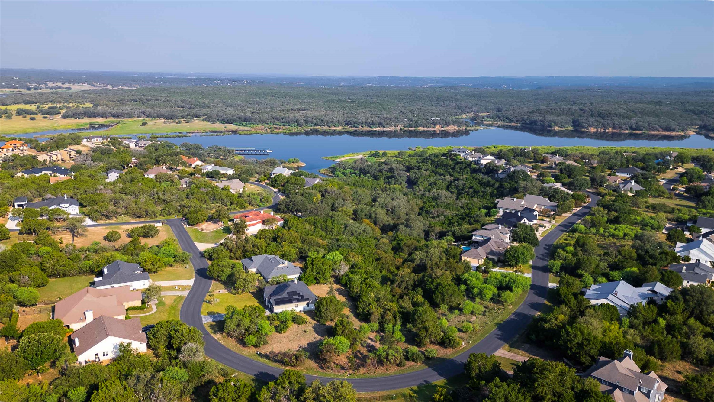 Lot 64 Wesley Ridge Drive Spicewood, TX 78669 - Photo 3 of 32 an aerial view of beach and residential houses with outdoor space