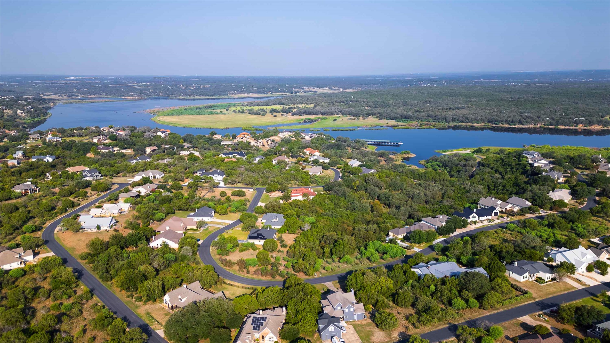 Lot 64 Wesley Ridge Drive Spicewood, TX 78669 - Photo 4 of 32 an aerial view of residential building and lake