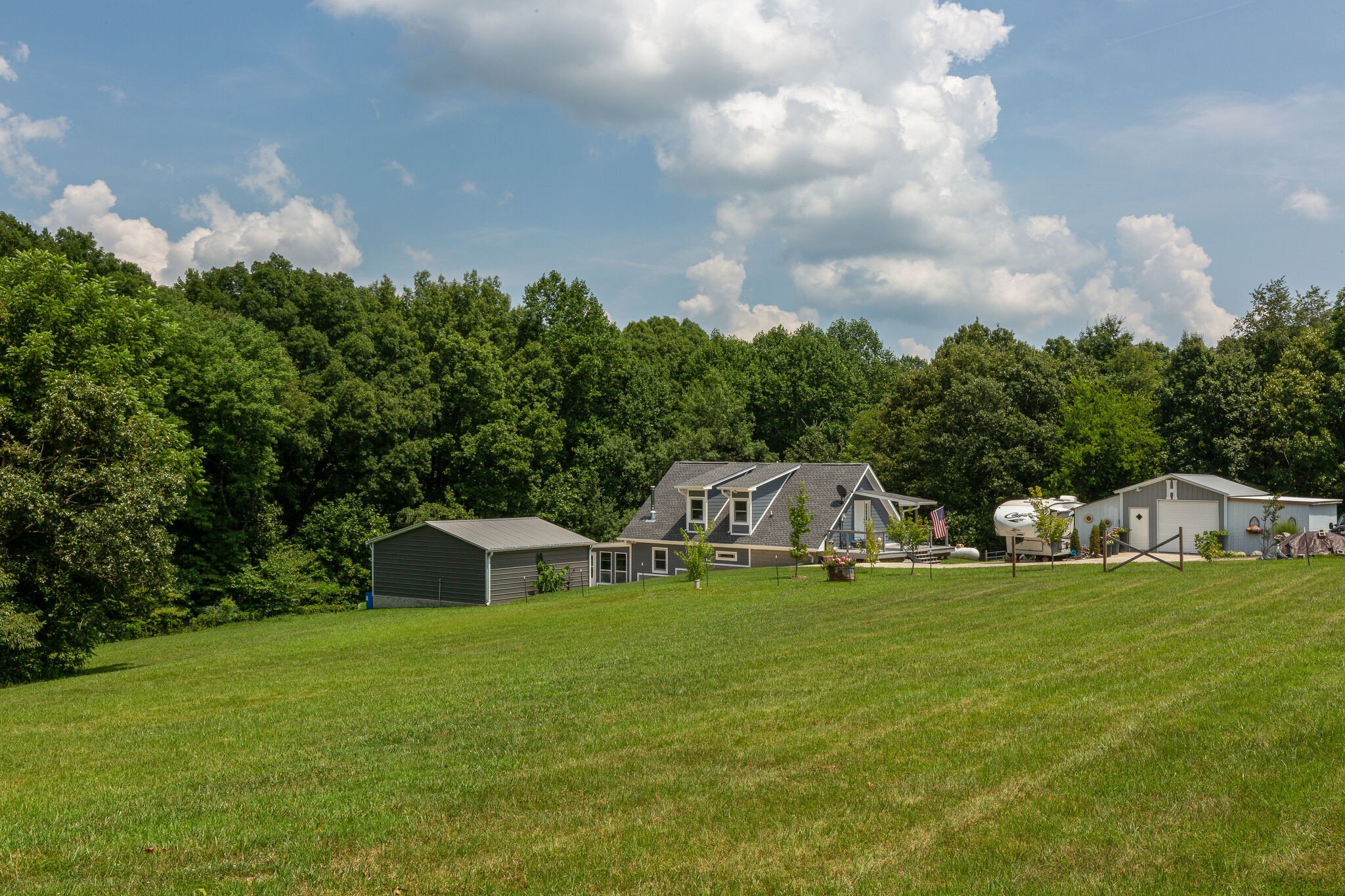 9953 Spring Creek Road Bon Aqua, TN 37025 - Photo 1 of 26 a view of a house with yard and sitting area