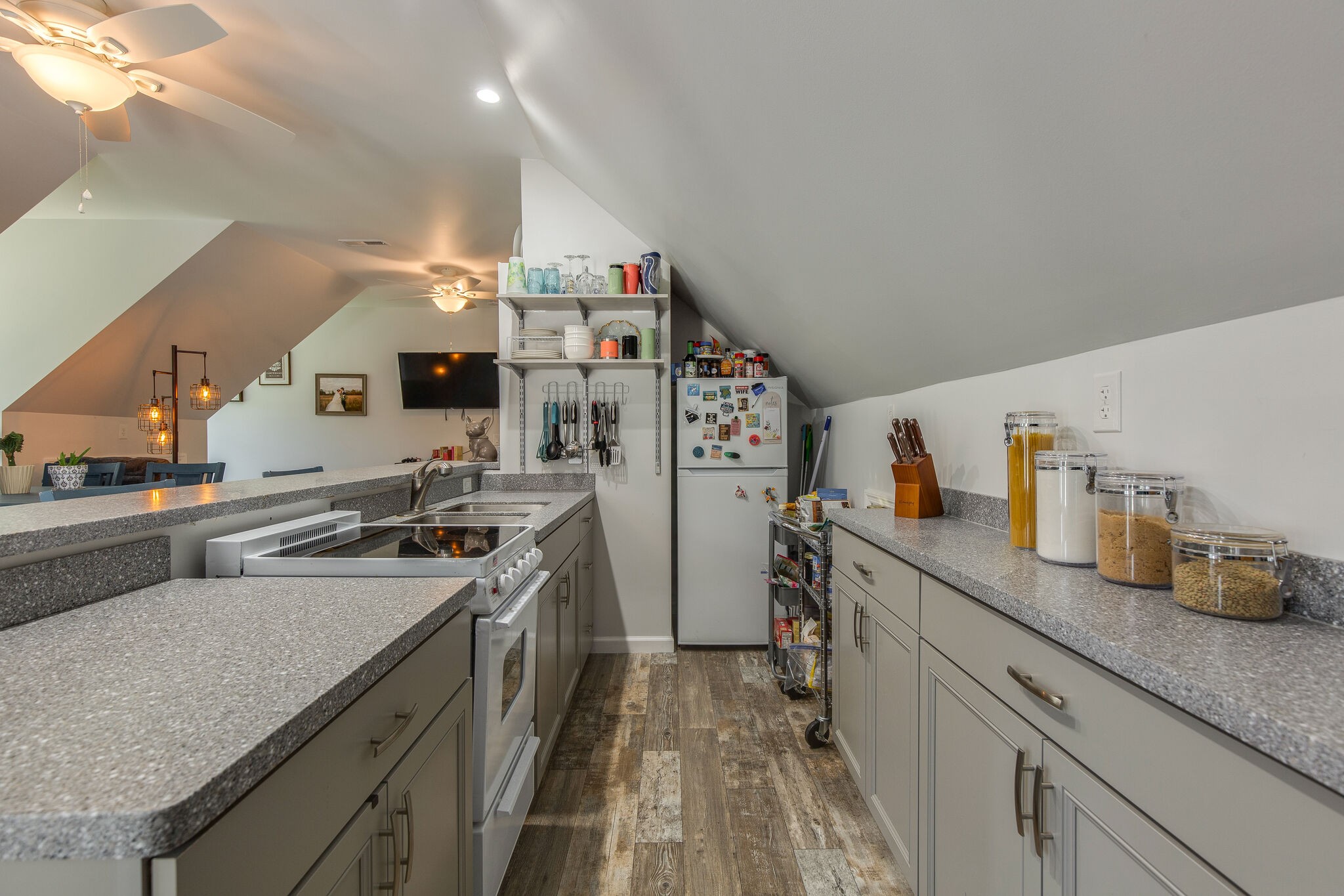 9953 Spring Creek Road Bon Aqua, TN 37025 - Photo 15 of 26 a kitchen with a sink stove and refrigerator