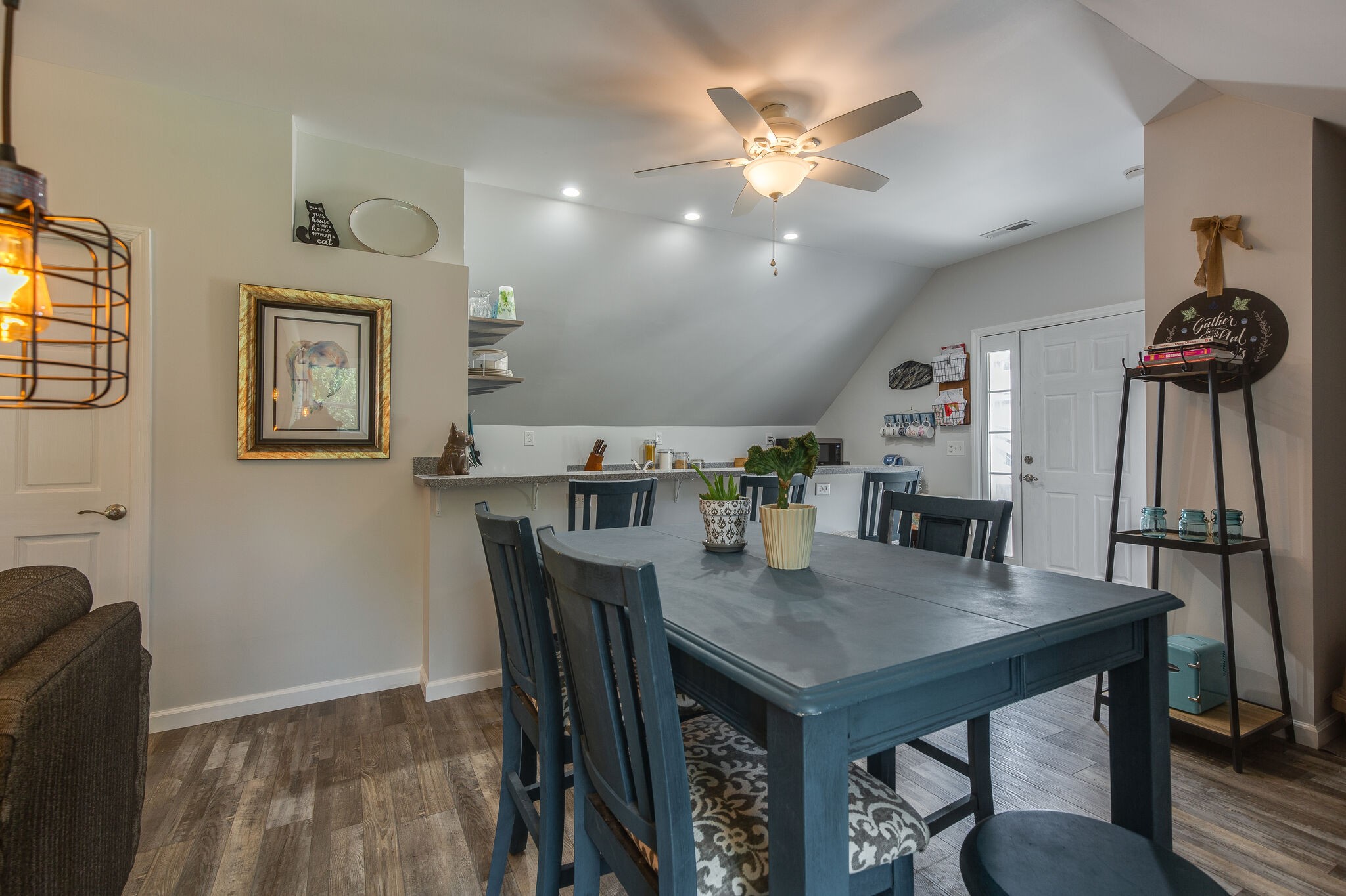9953 Spring Creek Road Bon Aqua, TN 37025 - Photo 16 of 26 a view of a dining room with furniture and wooden floor