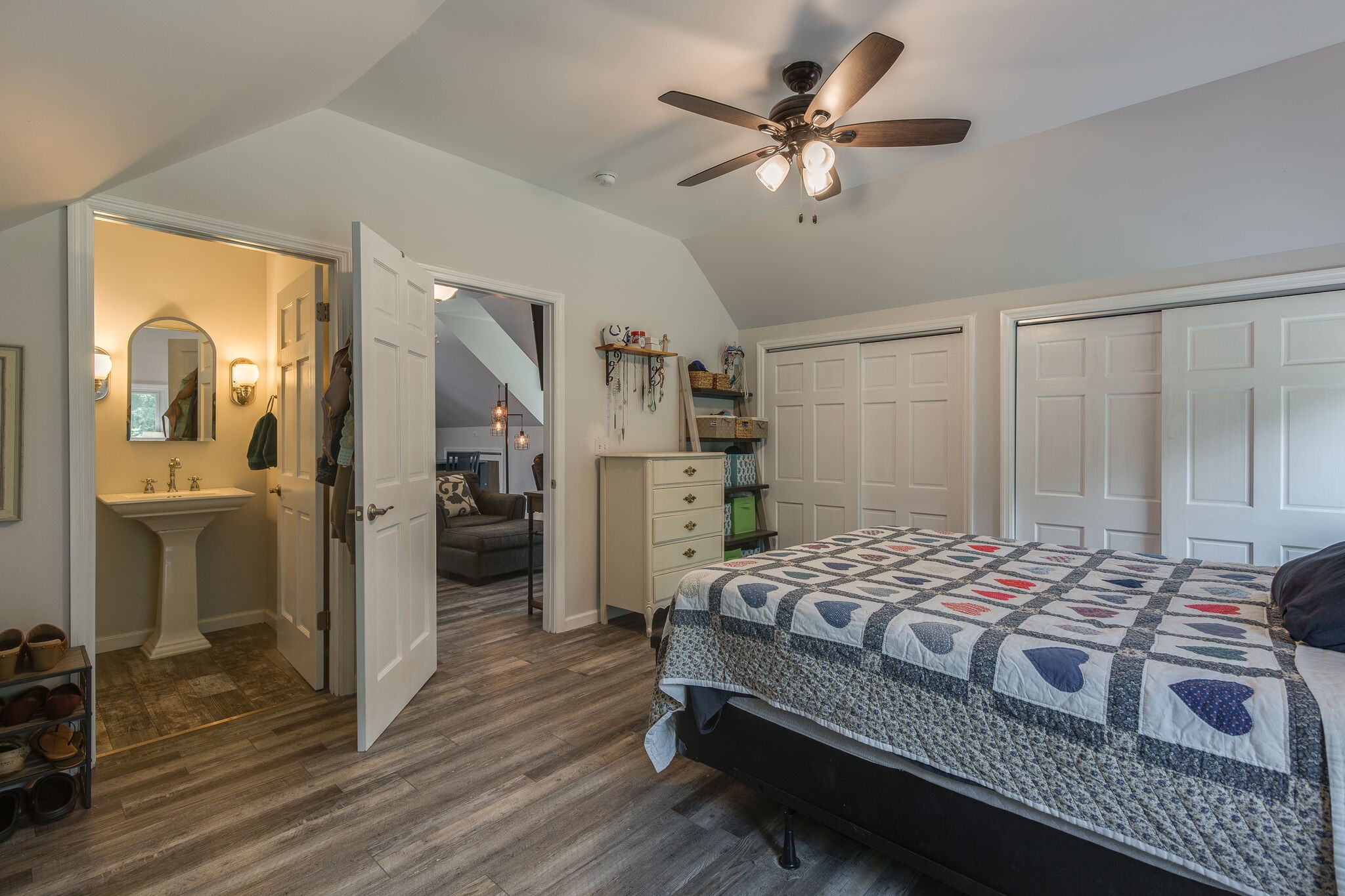 9953 Spring Creek Road Bon Aqua, TN 37025 - Photo 19 of 26 a bedroom with a bed and a walk in closet