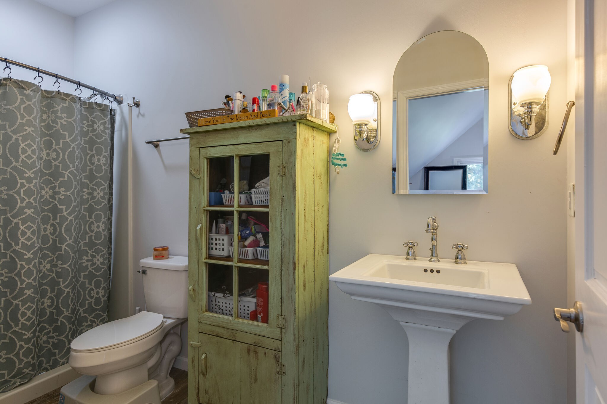 9953 Spring Creek Road Bon Aqua, TN 37025 - Photo 20 of 26 a bathroom with a sink mirror and toilet