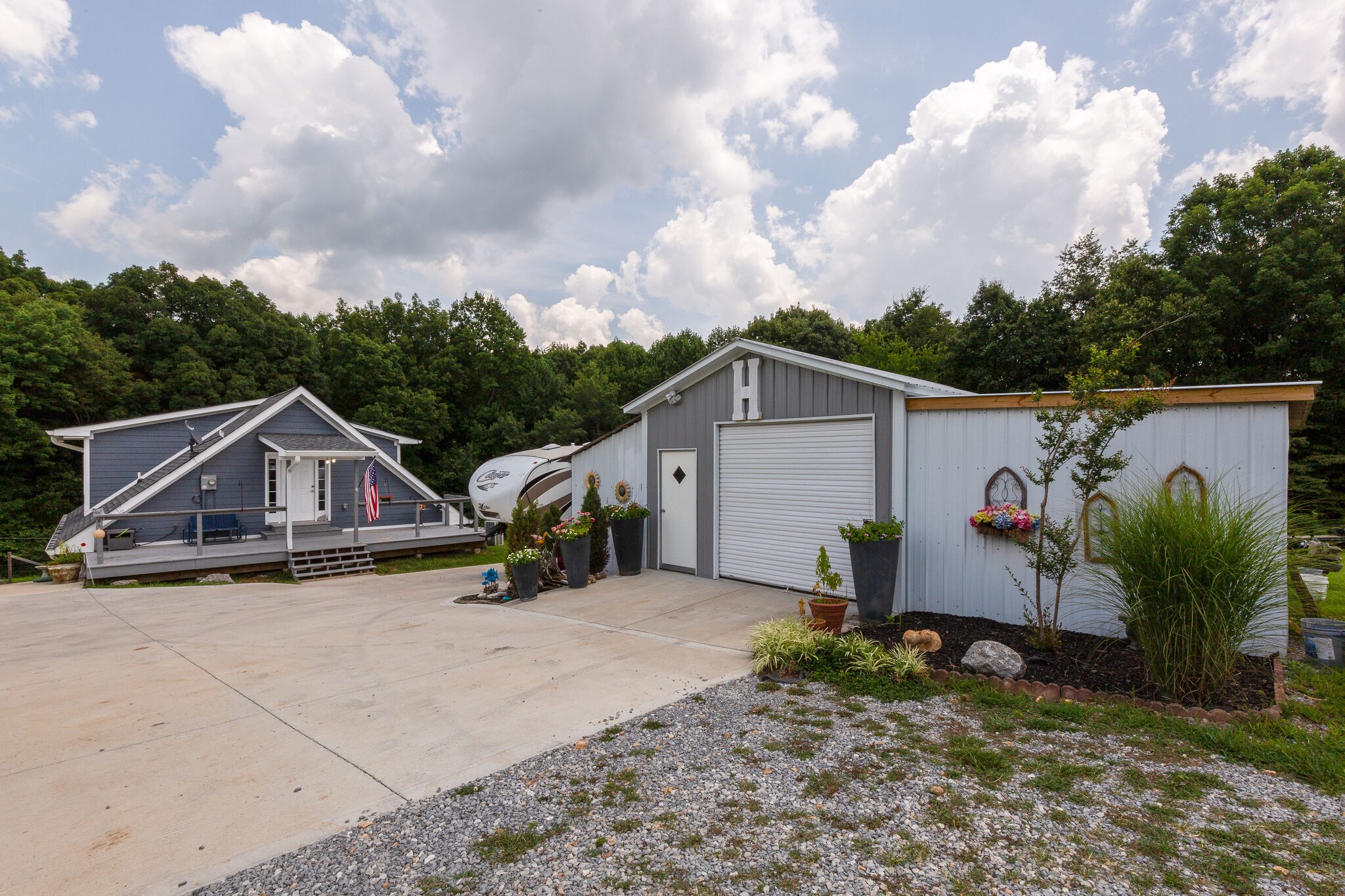 9953 Spring Creek Road Bon Aqua, TN 37025 - Photo 22 of 26 a view of a house with wooden fence