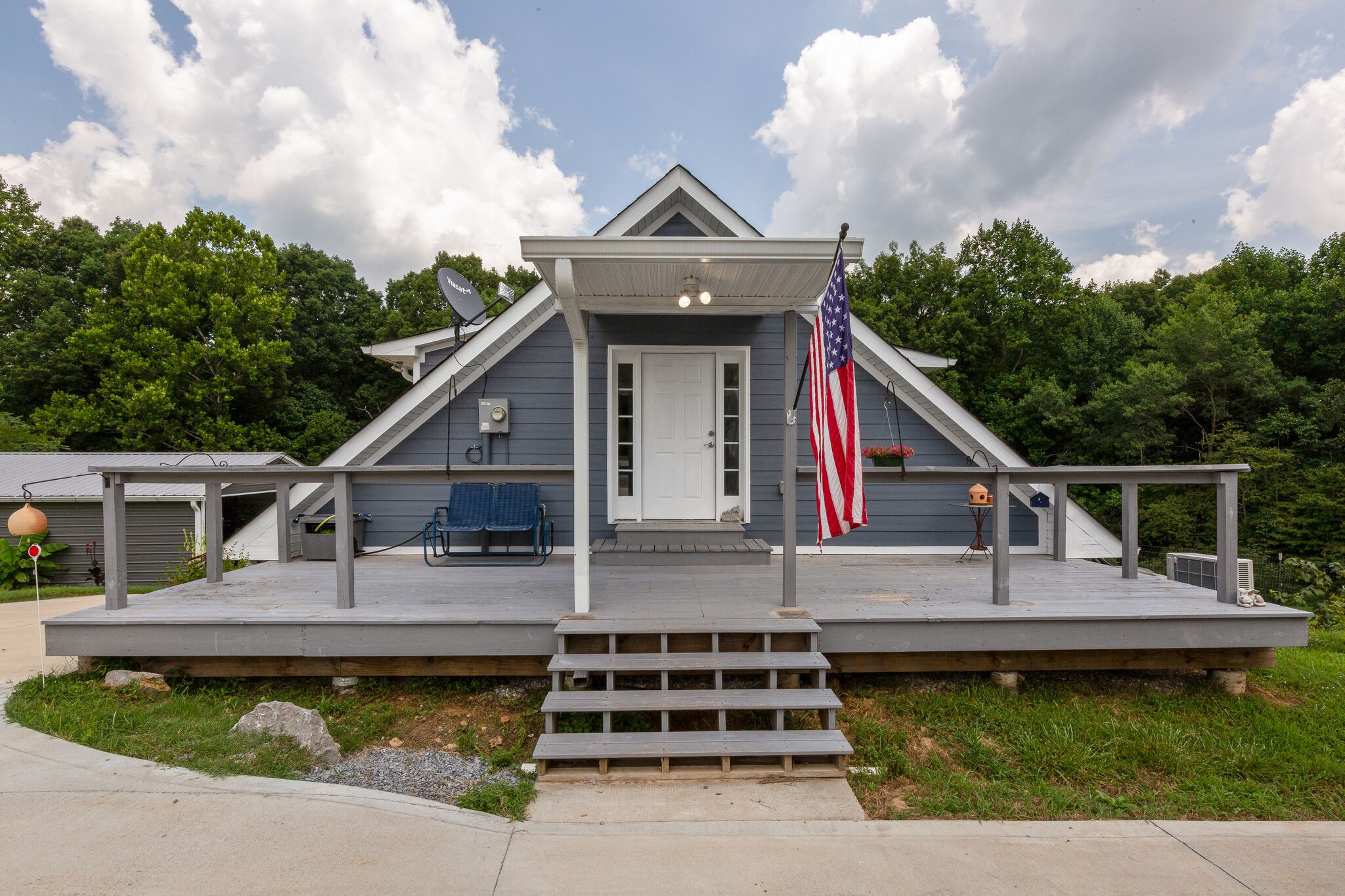 9953 Spring Creek Road Bon Aqua, TN 37025 - Photo 24 of 26 a front view of a house with a garden