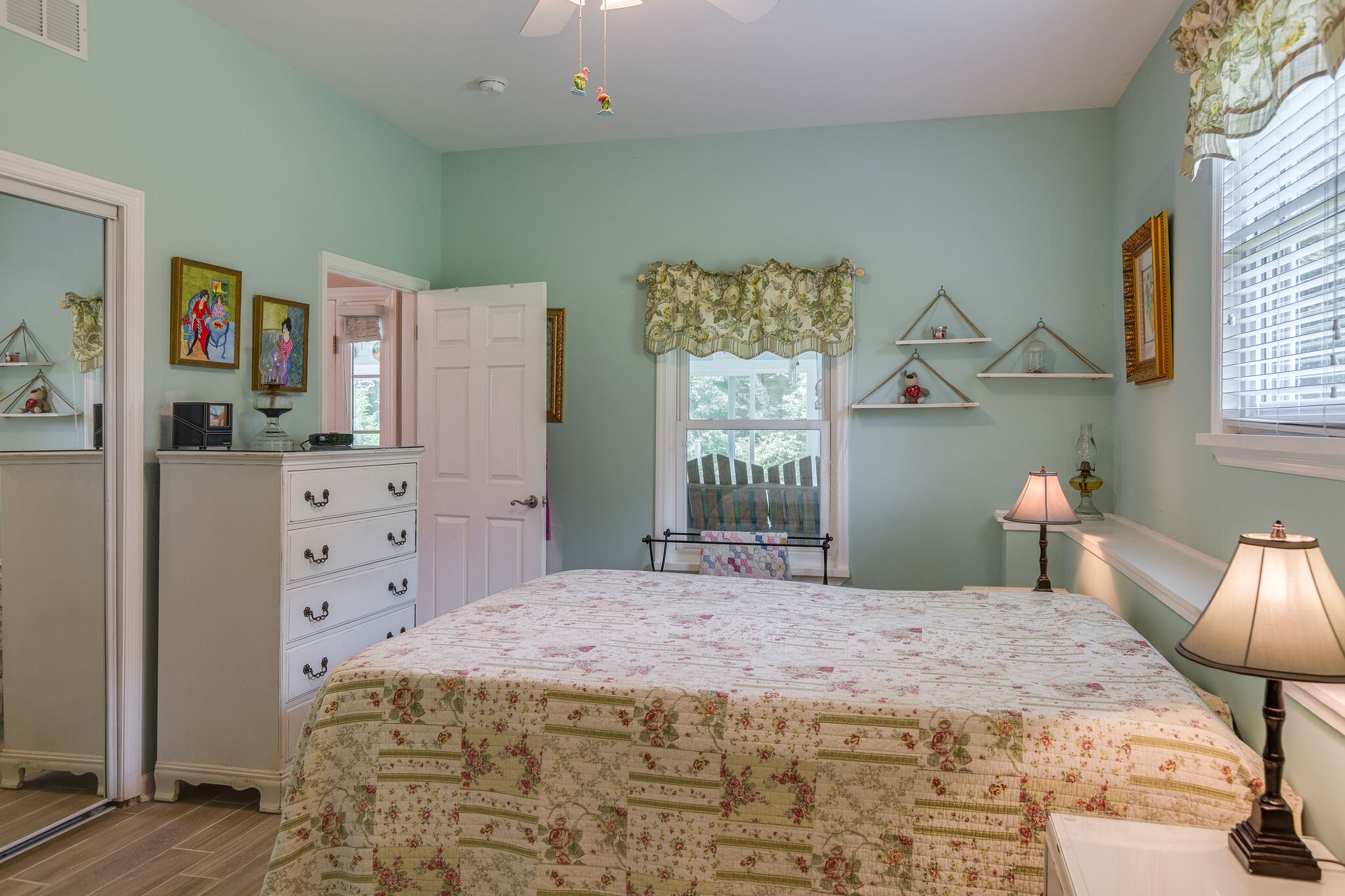 9953 Spring Creek Road Bon Aqua, TN 37025 - Photo 7 of 26 a bedroom with a bed and a dresser in it