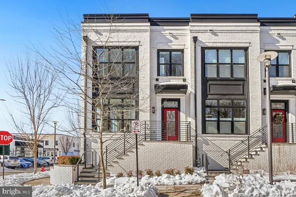 a balcony with table and chairs