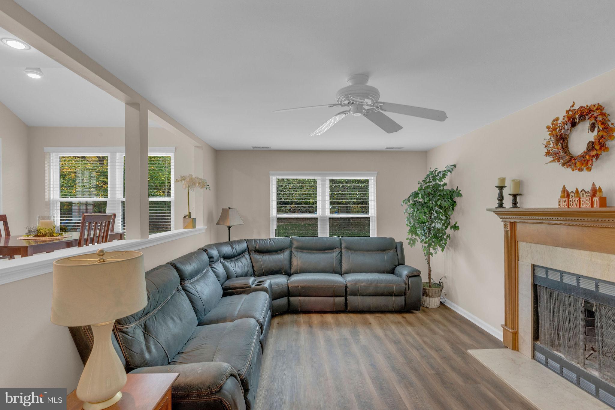 2158 Green Ridge Drive Warrington, PA 18976 - Photo 17 of 34 a living room with furniture a large window and a fireplace