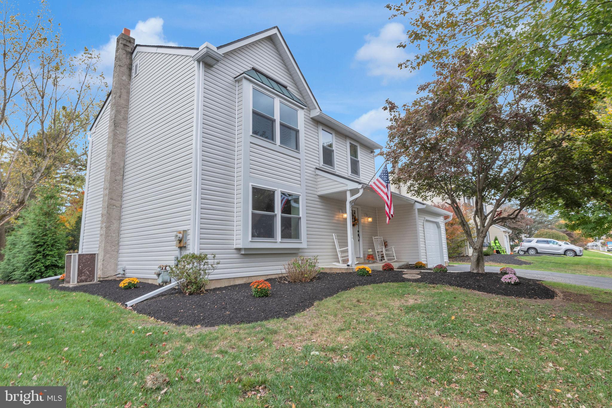 2158 Green Ridge Drive Warrington, PA 18976 - Photo 2 of 34 a front view of a house with a yard and trees