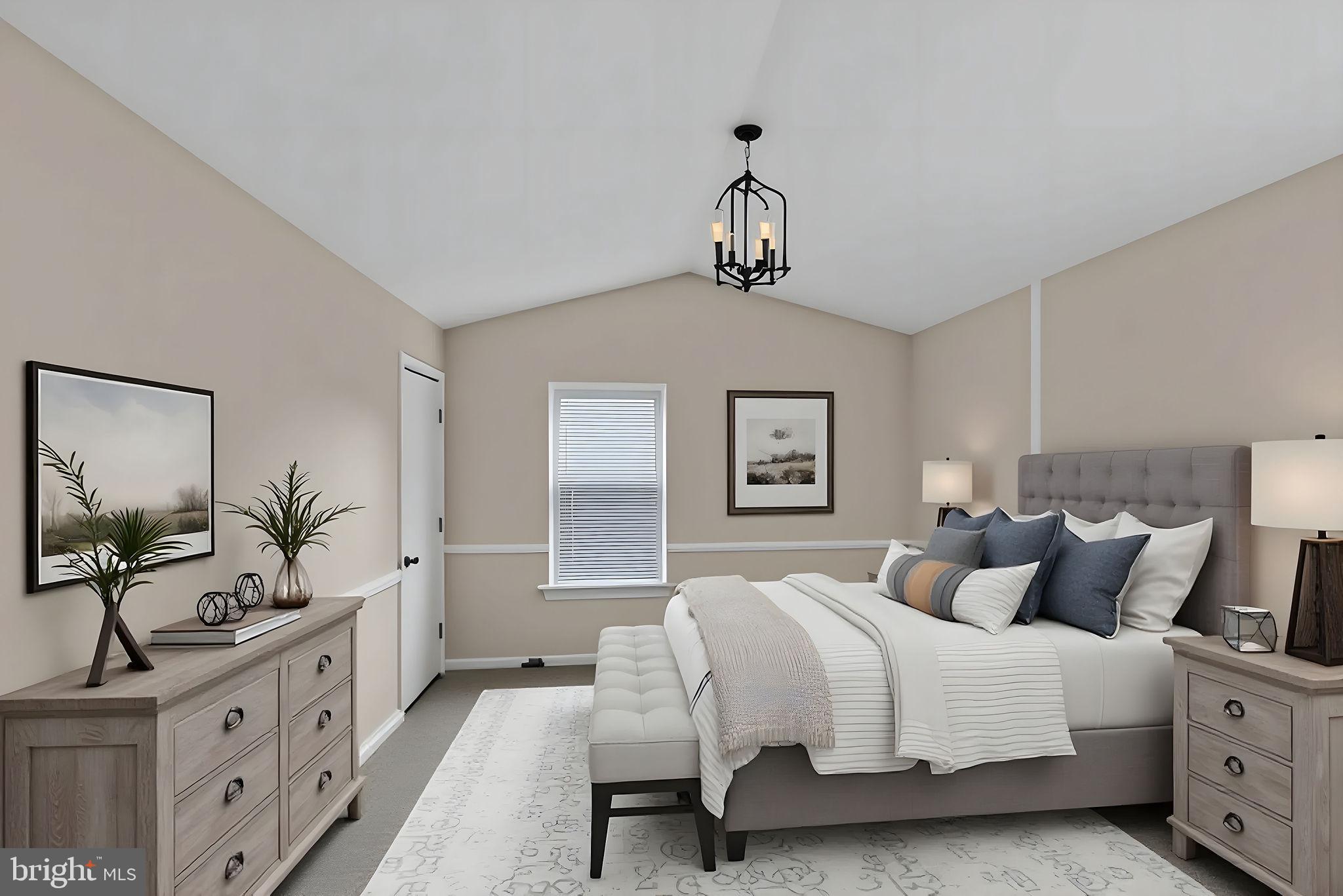 2158 Green Ridge Drive Warrington, PA 18976 - Photo 24 of 34 a bedroom with a large bed and a chandelier