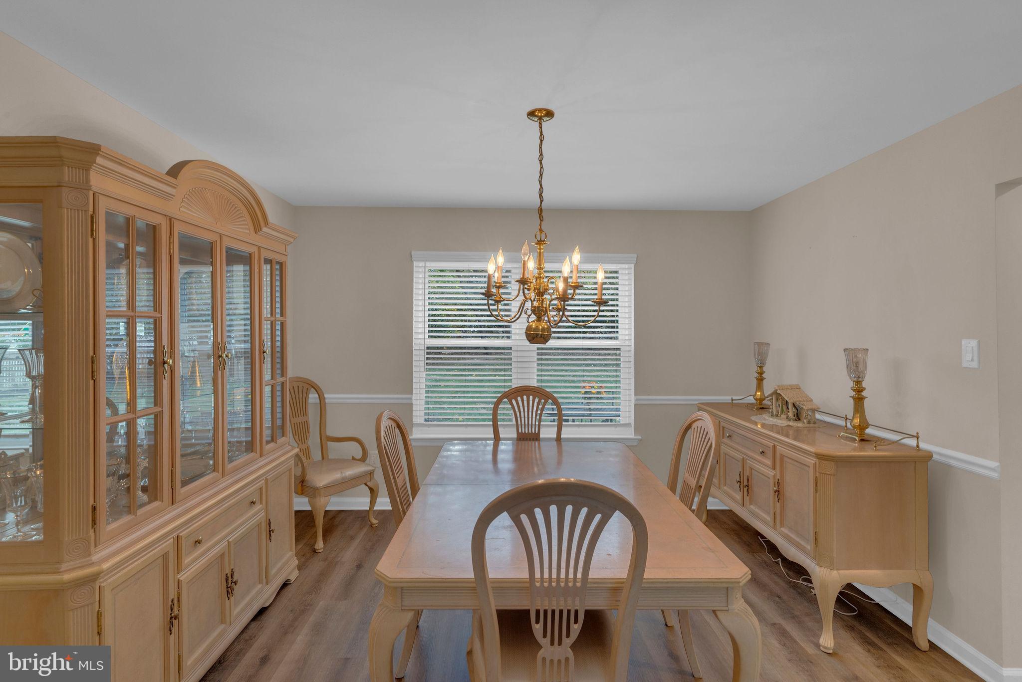 2158 Green Ridge Drive Warrington, PA 18976 - Photo 10 of 34 a view of a dining room with furniture window and wooden floor