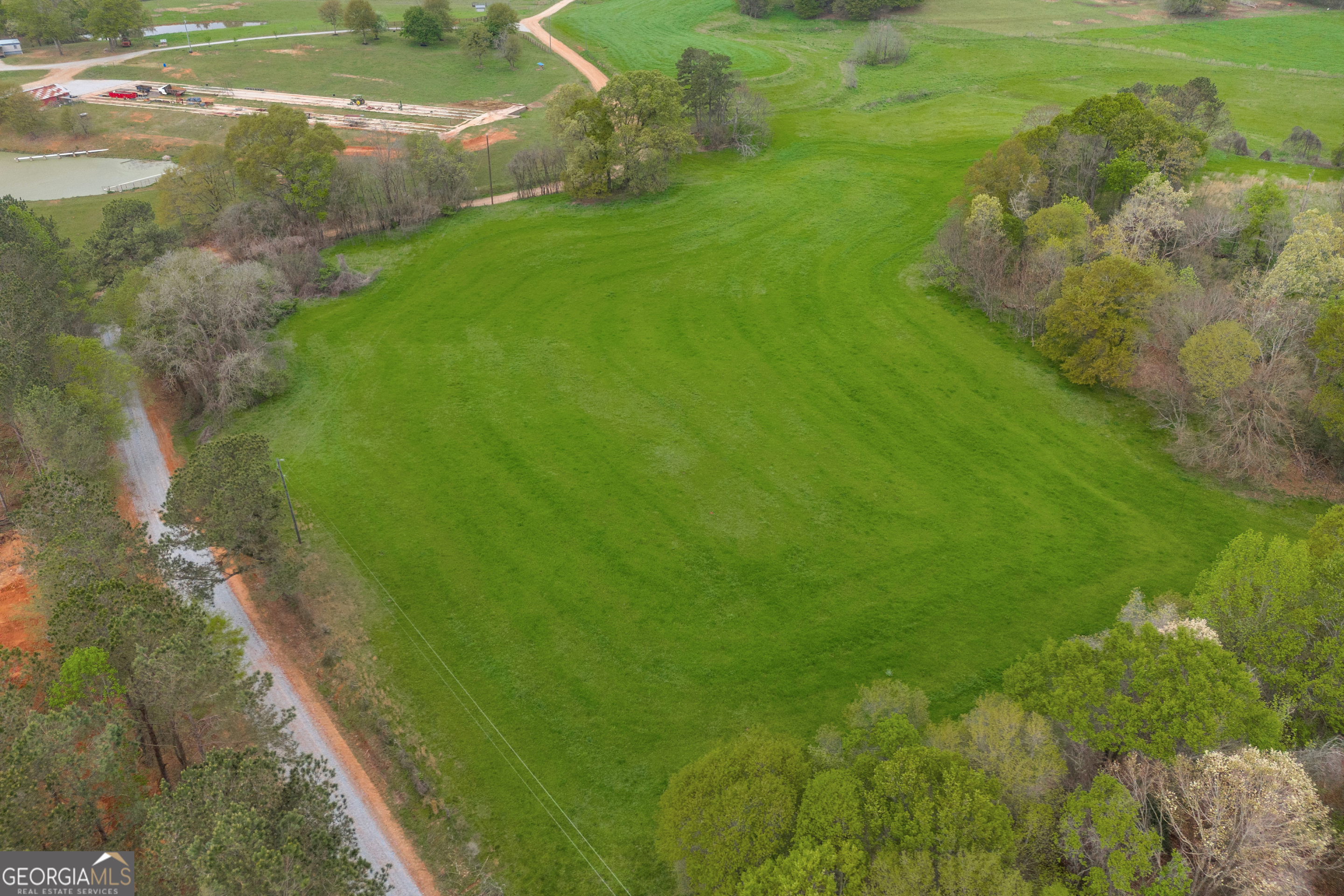 0 Carey-Ford Road Danielsville, GA 30633 - Photo 14 of 33 a view of a lake with huge green field