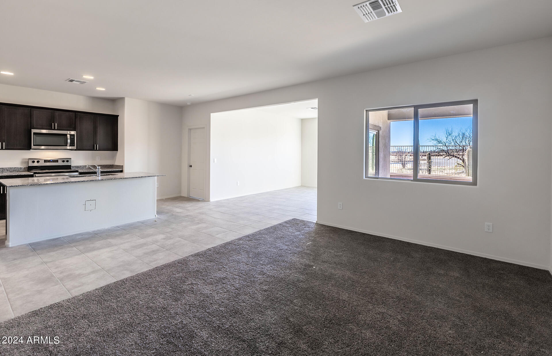 24379 West Ripple Road Buckeye, AZ 85326 - Photo 15 of 30 13 - Gathering Room and Kitchen