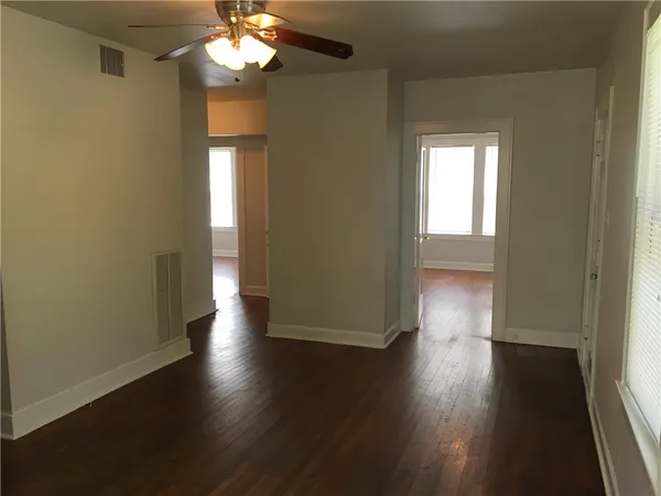 a view of livingroom with hardwood floor and ceiling fan