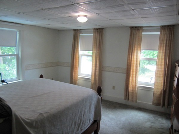 58 South Main Street Ashburnham, MA 01430 - Photo 14 of 20 a bedroom with a bed and a window
