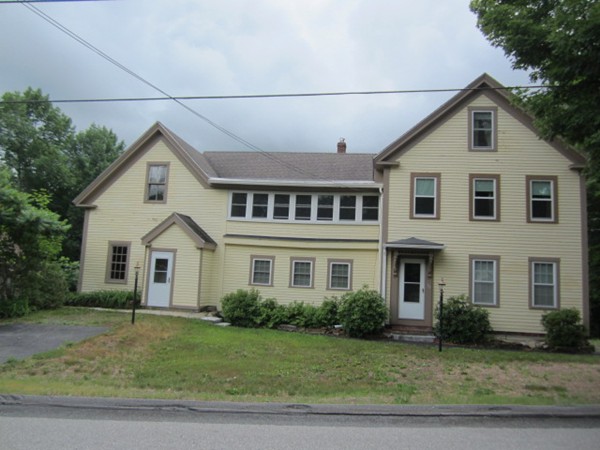 58 South Main Street Ashburnham, MA 01430 - Photo 2 of 20 a front view of a house with a yard