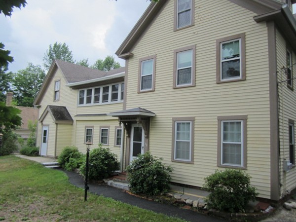58 South Main Street Ashburnham, MA 01430 - Photo 3 of 20 a front view of a house with garden and porch