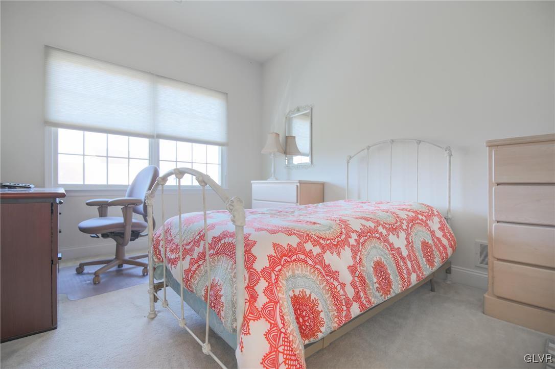 580 Rockbridge Road Nazareth, PA 18064 - Photo 22 of 30 a bedroom with a bed and a mirror