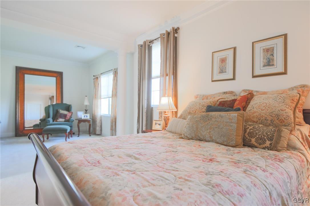 580 Rockbridge Road Nazareth, PA 18064 - Photo 23 of 30 a bedroom with a large bed and a large mirror