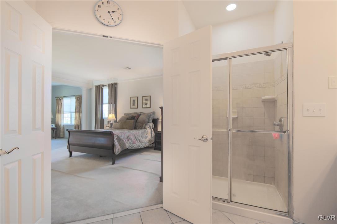 580 Rockbridge Road Nazareth, PA 18064 - Photo 29 of 30 a bedroom with a bed and a glass door shower
