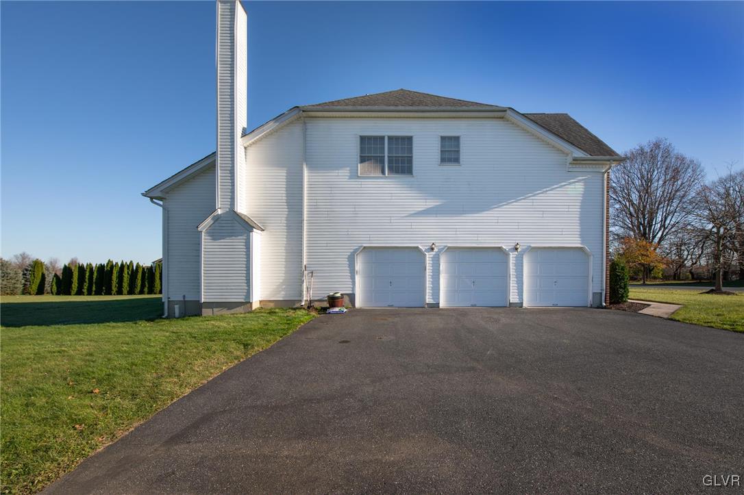 580 Rockbridge Road Nazareth, PA 18064 - Photo 30 of 30 a front view of a house with a yard and garage