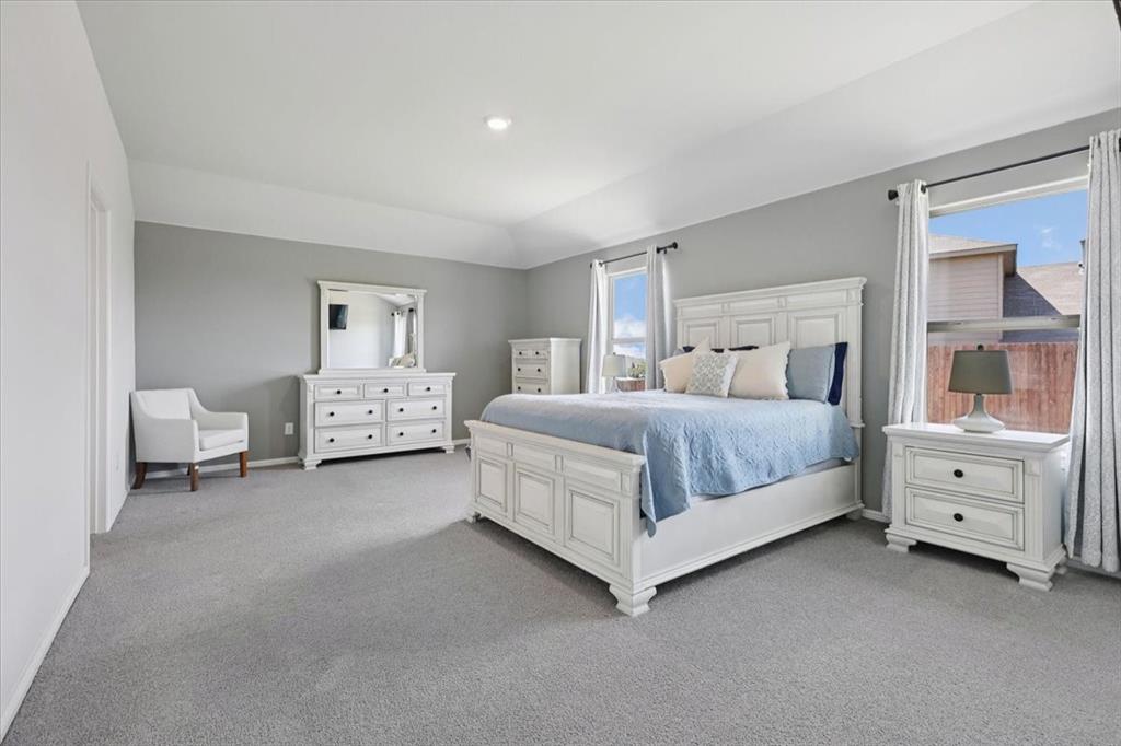 16733 Portage Street Justin, TX 76247 - Photo 12 of 39 a bedroom with a bed and a dresser