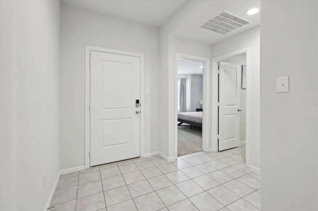 16733 Portage Street Justin, TX 76247 - Photo 19 of 39 a spacious bathroom with a granite countertop sink and a mirror