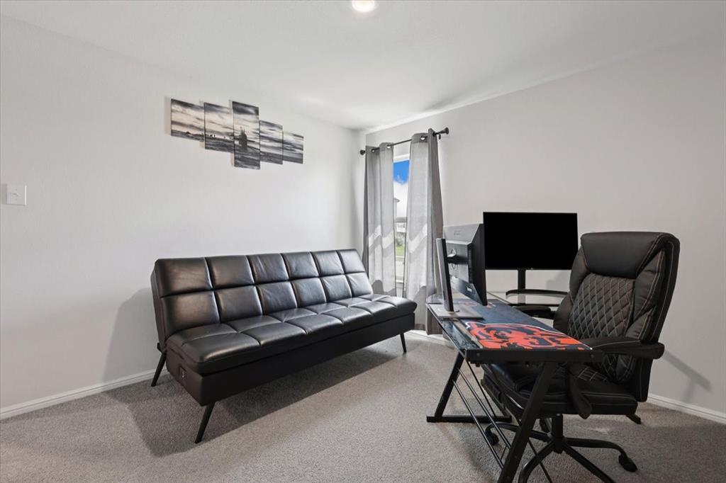 16733 Portage Street Justin, TX 76247 - Photo 24 of 39 a living room with furniture and a wooden floor