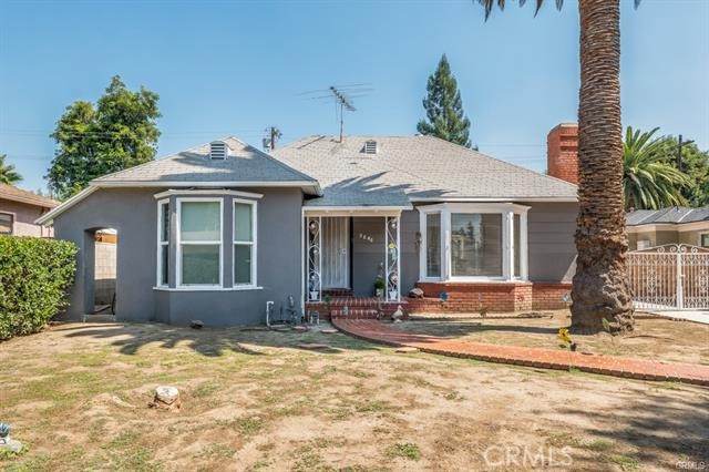 5646-5646 Vesper Avenue Sherman Oaks, CA 91411 - Photo 1 of 17 a front view of a house with a yard
