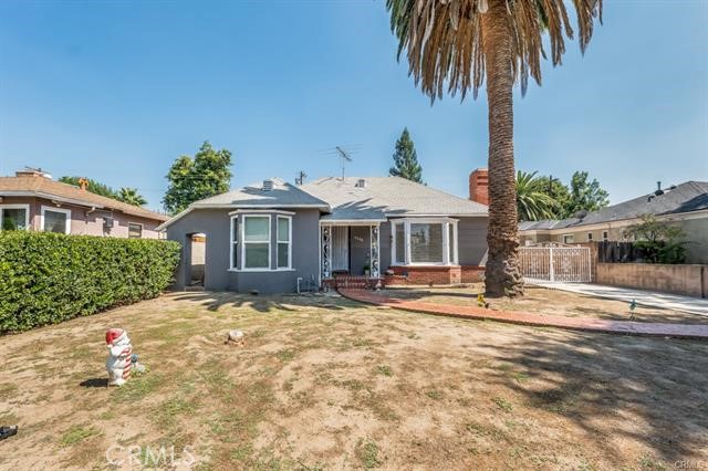 5646-5646 Vesper Avenue Sherman Oaks, CA 91411 - Photo 3 of 17 a front view of a house with garden and trees