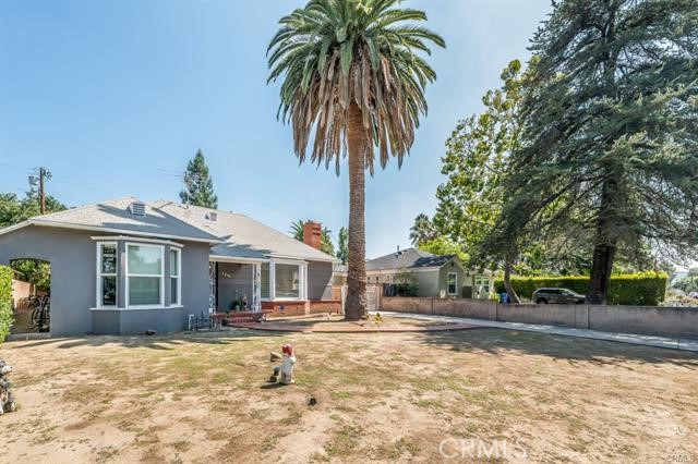 5646-5646 Vesper Avenue Sherman Oaks, CA 91411 - Photo 4 of 17 a house with palm tree in front of it