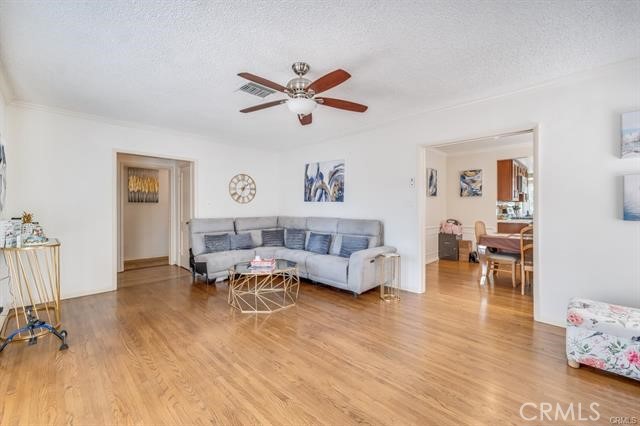 5646-5646 Vesper Avenue Sherman Oaks, CA 91411 - Photo 6 of 17 a living room with furniture and a wooden floor