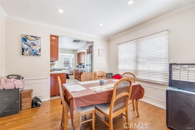 5646-5646 Vesper Avenue Sherman Oaks, CA 91411 - Photo 9 of 17 a view of a dining room with furniture window and wooden floor