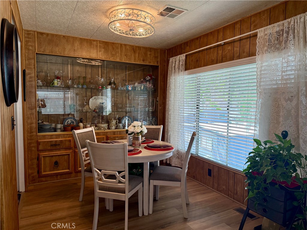 71 Van Buren Riverside, CA 92504 - Photo 11 of 30 a dining room with furniture window and wooden floor
