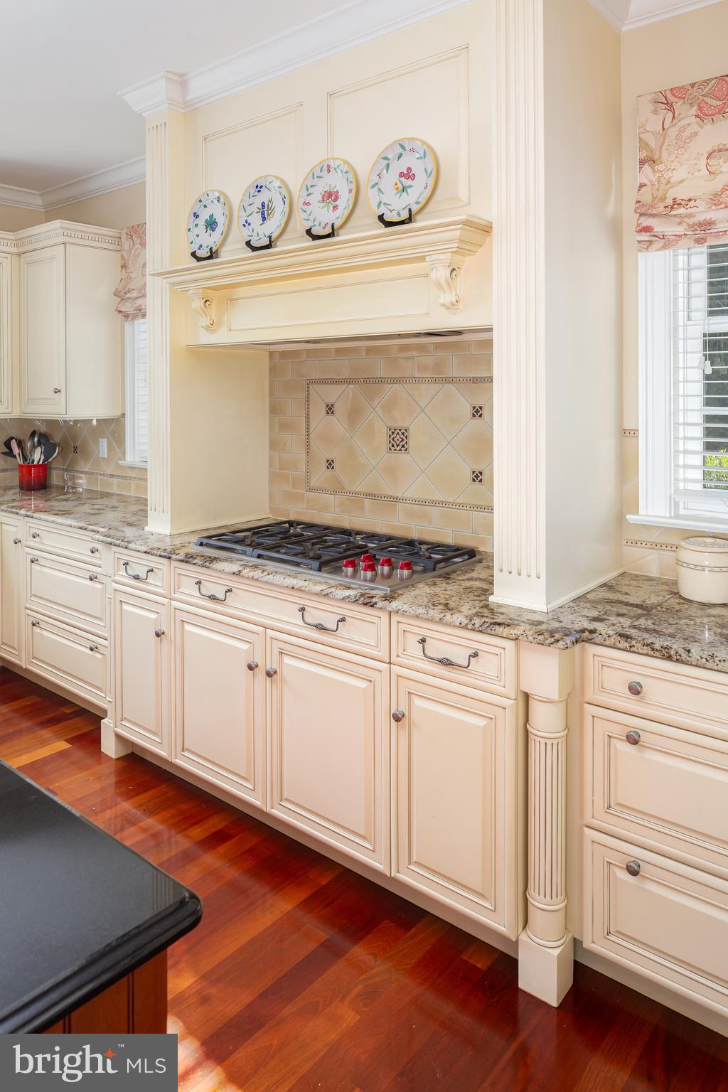 152 Grubb Road Malvern, PA 19355 - Photo 29 of 74 a kitchen with granite countertop stainless steel appliances a stove and white cabinets