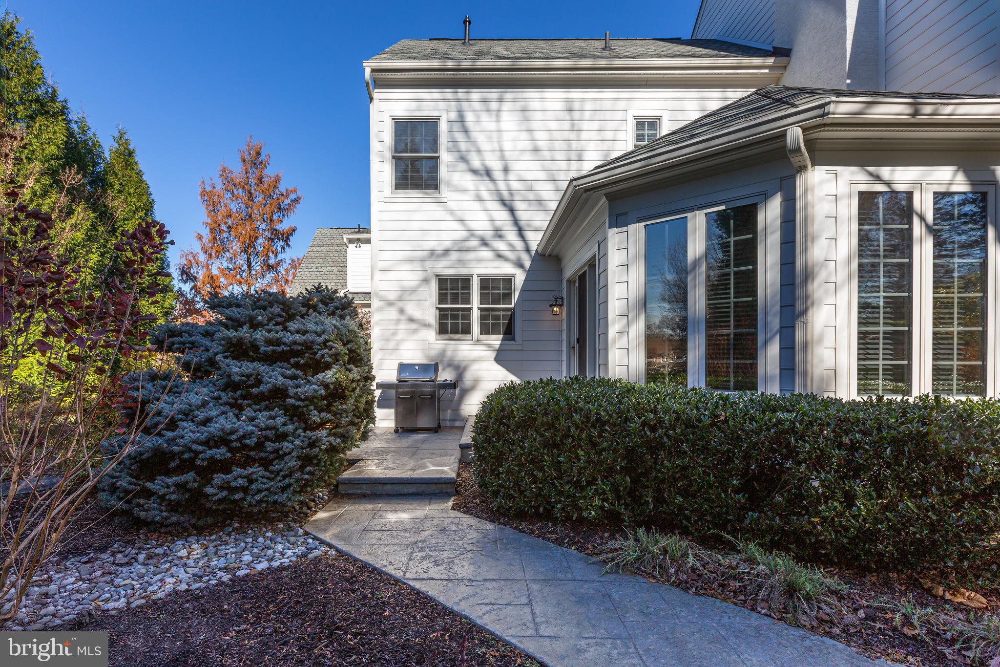 152 Grubb Road Malvern, PA 19355 - Photo 68 of 74 a view of a house with a yard and potted plants