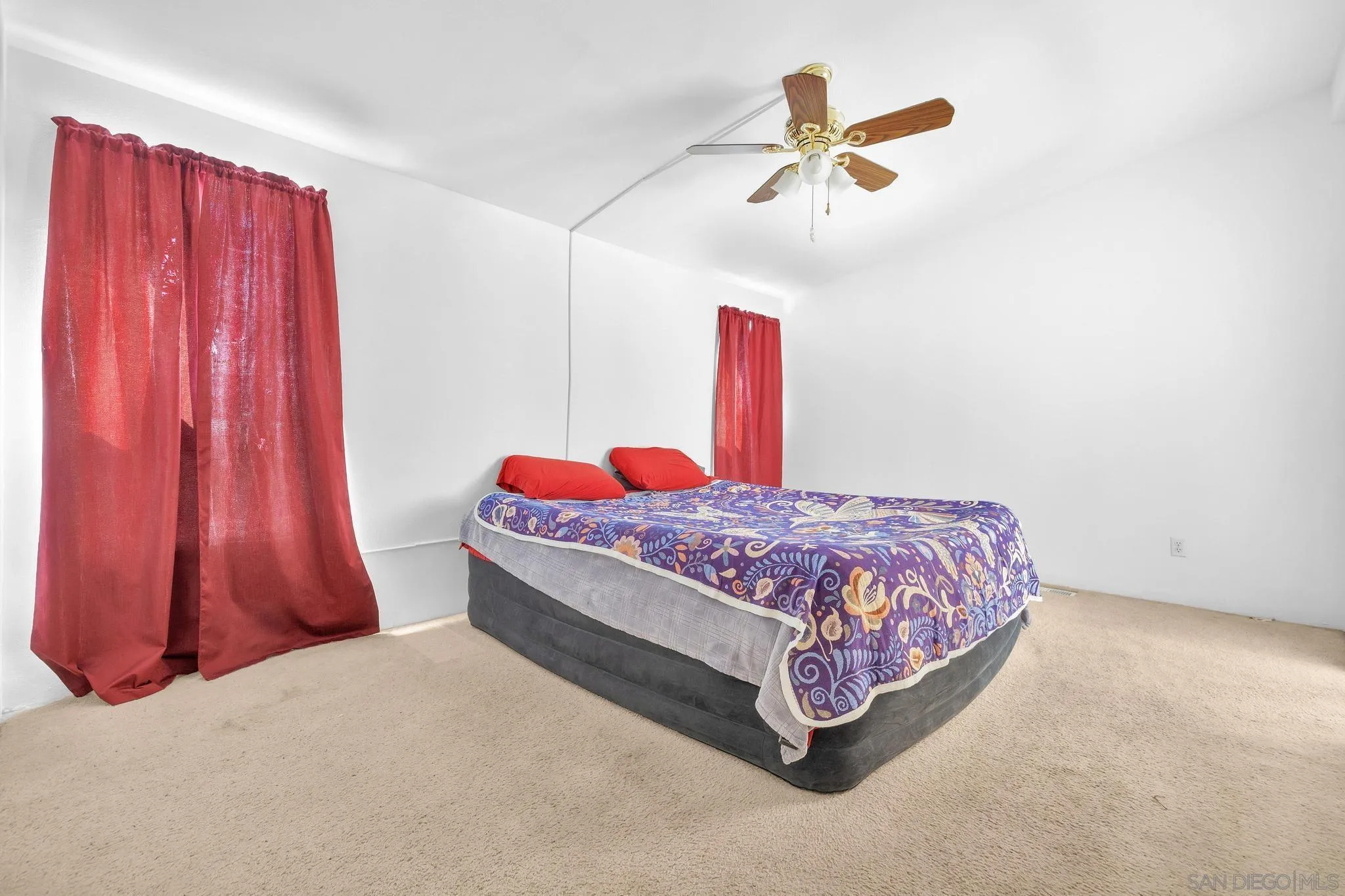10880 Highway 67, Unit 74 Lakeside, CA 92040 - Photo 6 of 18 a bed room with a bed and a ceiling fan