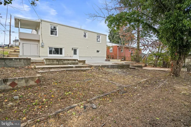 a view of a backyard of the house